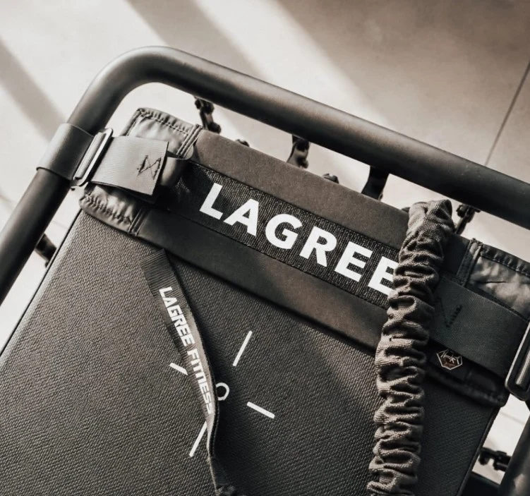 Close-up of a Lagree machine carriage, strap and spring